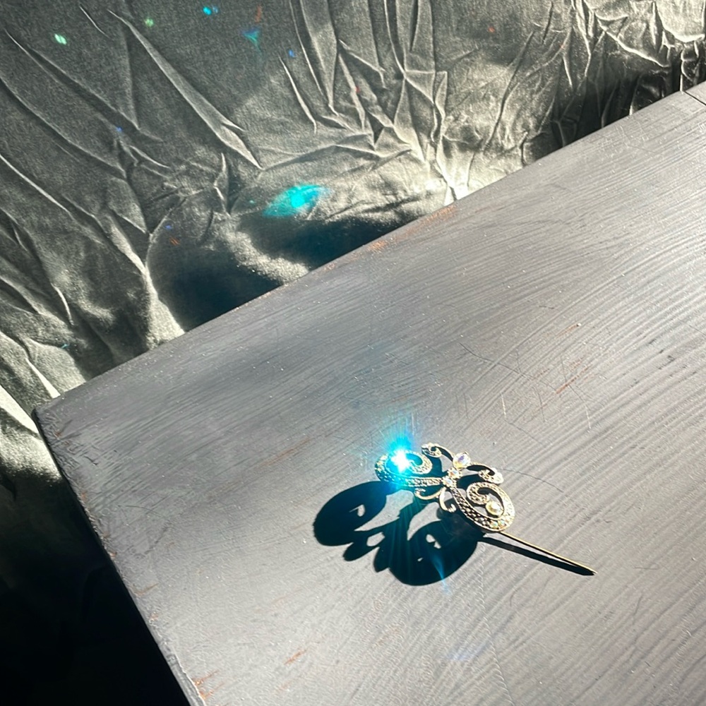 Vintage butterfly broach pin antique bronze The jewels around the wings an body.